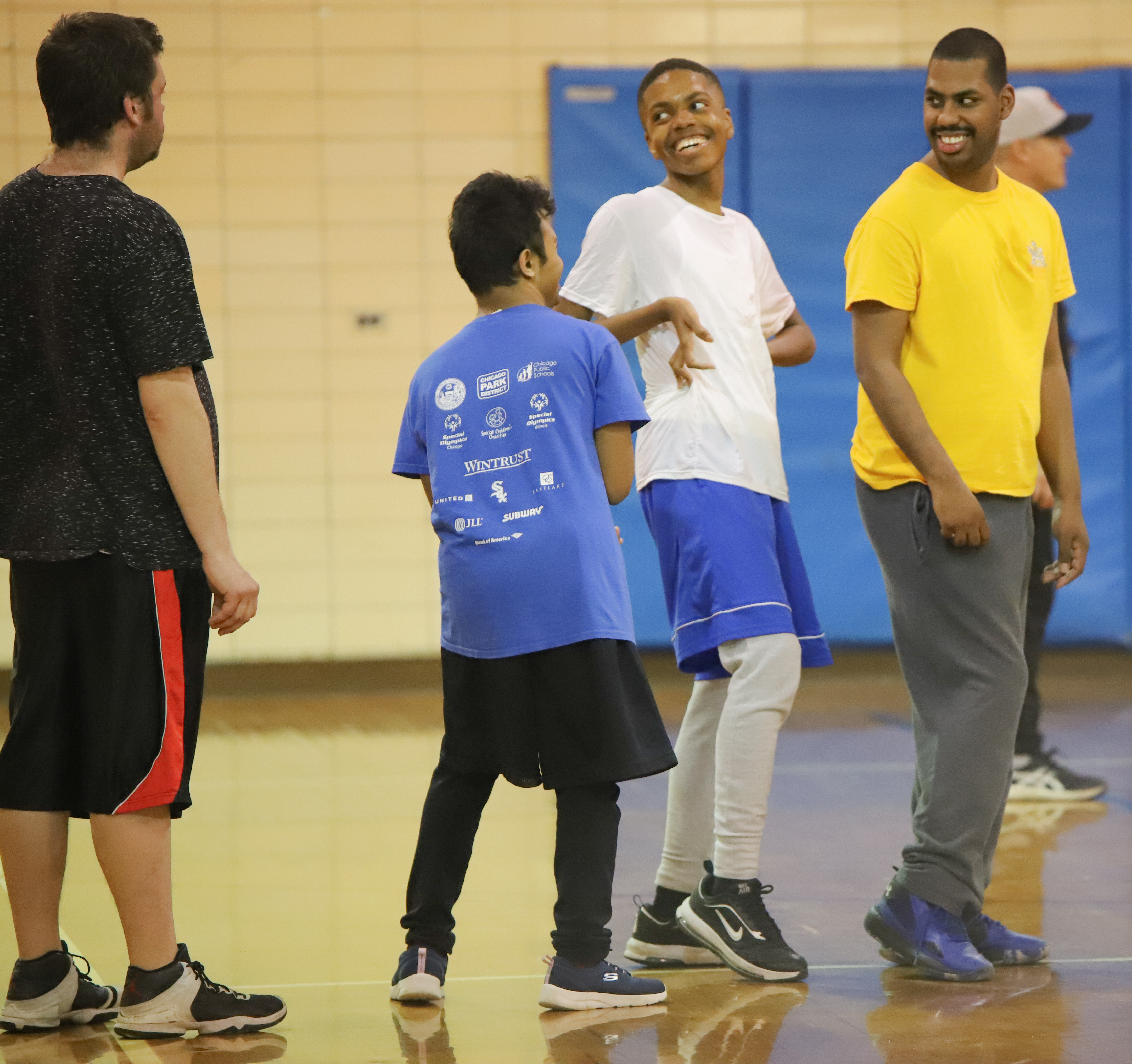 Athletes chat during basketball practice at Loyola Park in Chicago on March 1. (Photo by Samantha Davis)